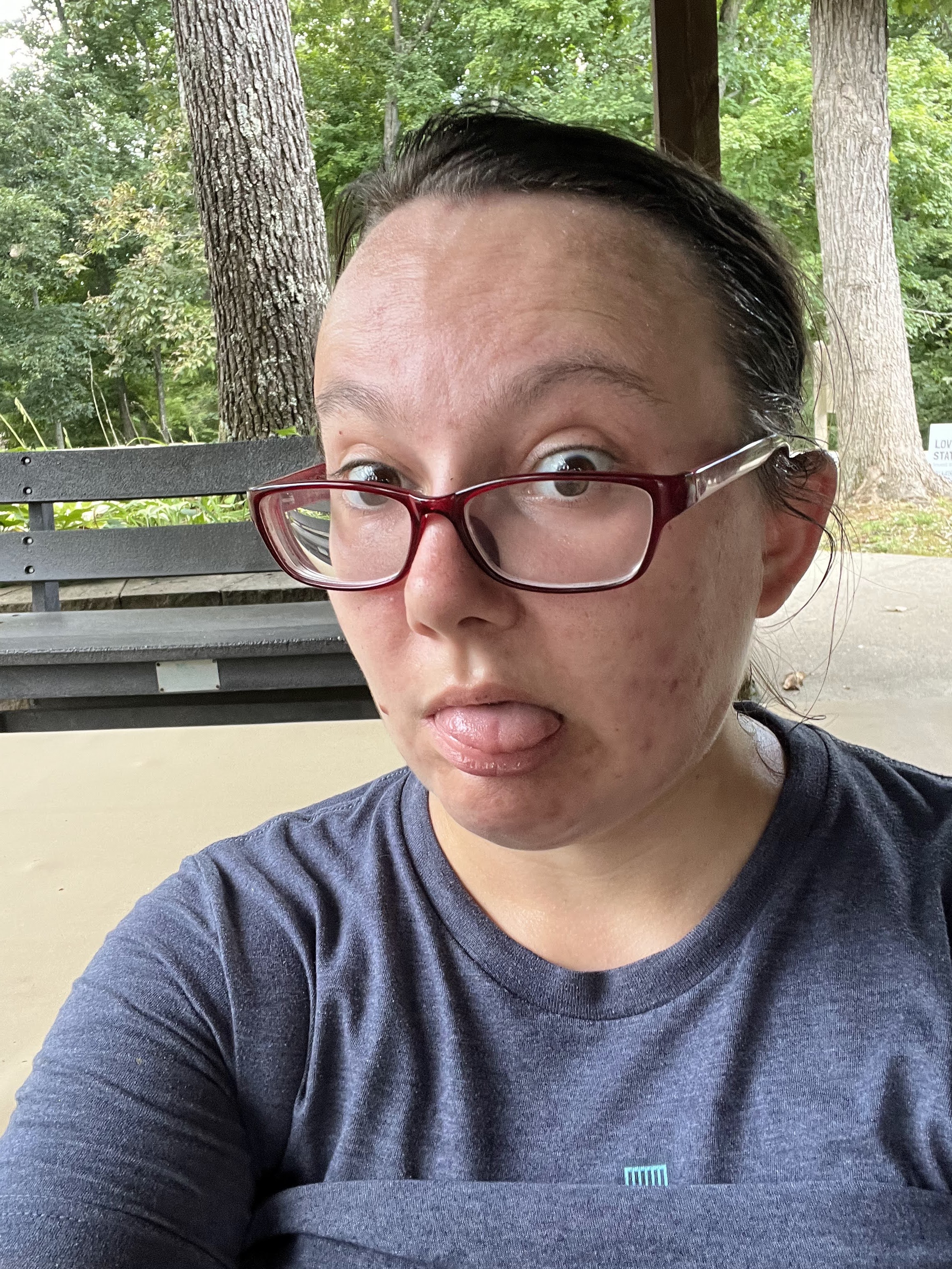 A tired Liz sticks her tongue out after hiking up a huge hill