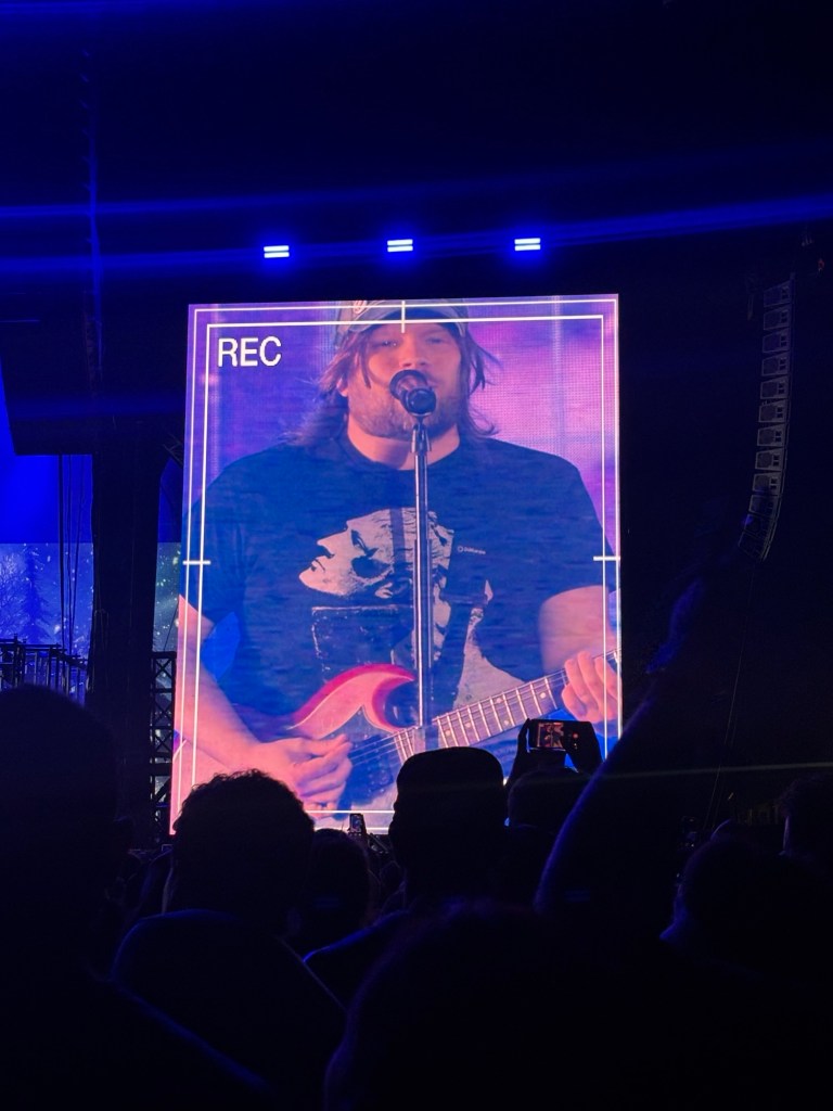 Patrick Stump playing guitar onstage