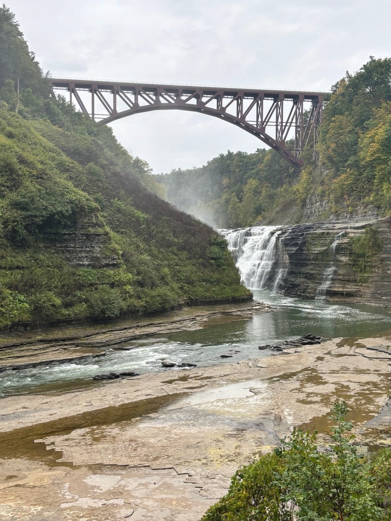 Waterfall and bridge in the canyon
